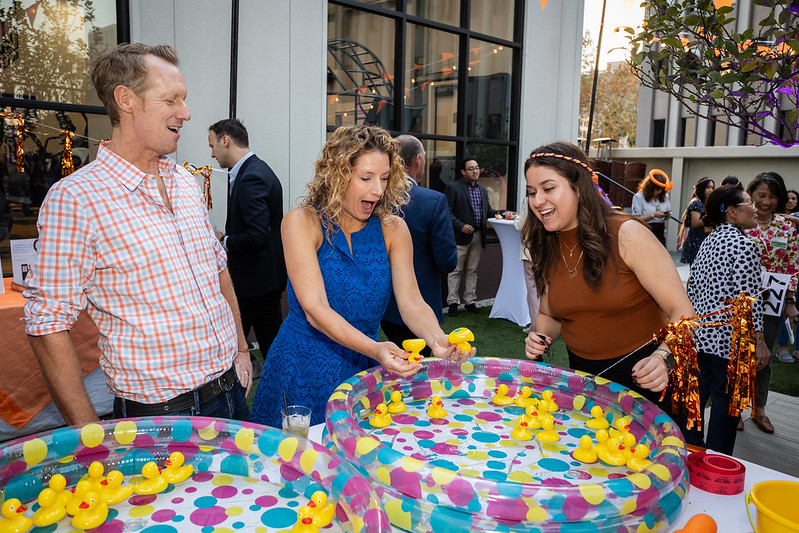 Guests enjoying carnival games at the 2024 Champions for Children Dinner