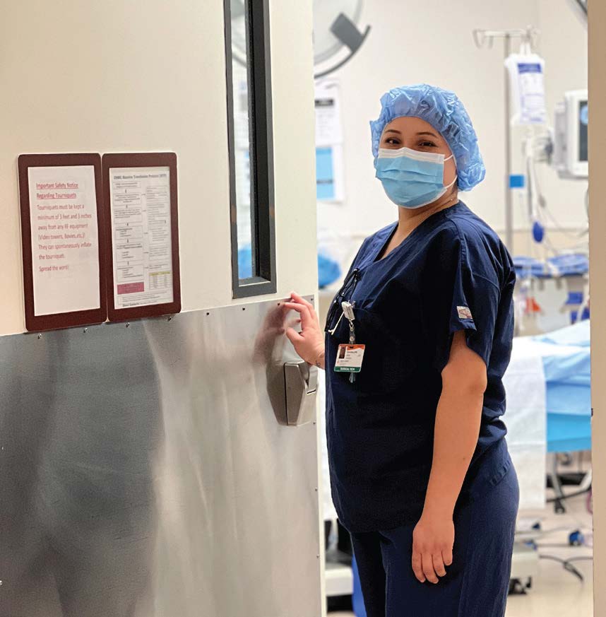 Lupe Cruz in scrubs outside of the operating room